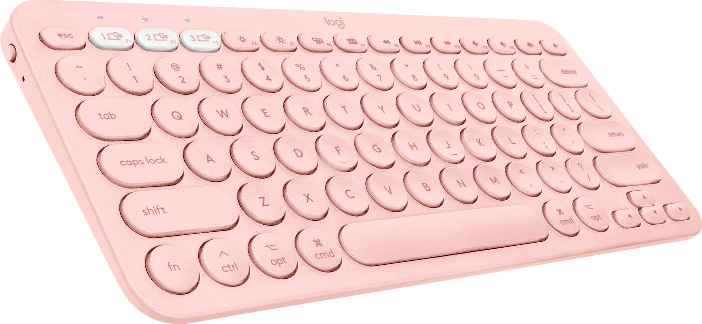 The image shows a pink keyboard with a white background. The keyboard has a number pad on the right side, and the keys are labeled with numbers and letters. The text on the image reads "esc 10 F1 29 F2 3 F5 * 1A P5 logi 80 16 17 4 F8 MI 3 W P 4 PO ~ ! @ 1 2 tab Q caps lock shift # 3 W A $ 4 E S Z % 5 R D X A 6 T F - C & Y G V * 8 U H B I - + delete 9 0 = I 1 / / O P I 1 \ W : return L K L - < > ? M I N I t 3 cmd opt shift fn ctrl opt g cmd."