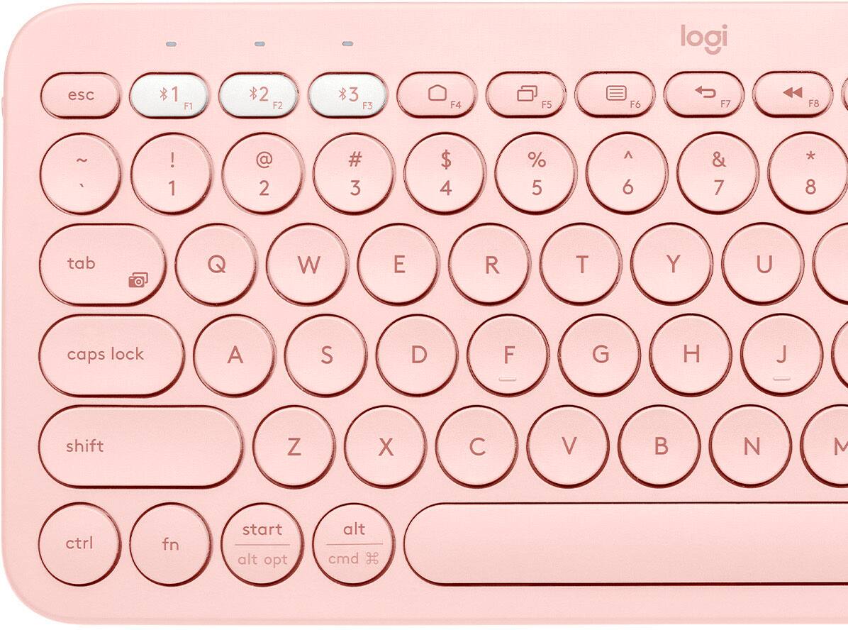 logi keyboard with pink case and white keys.