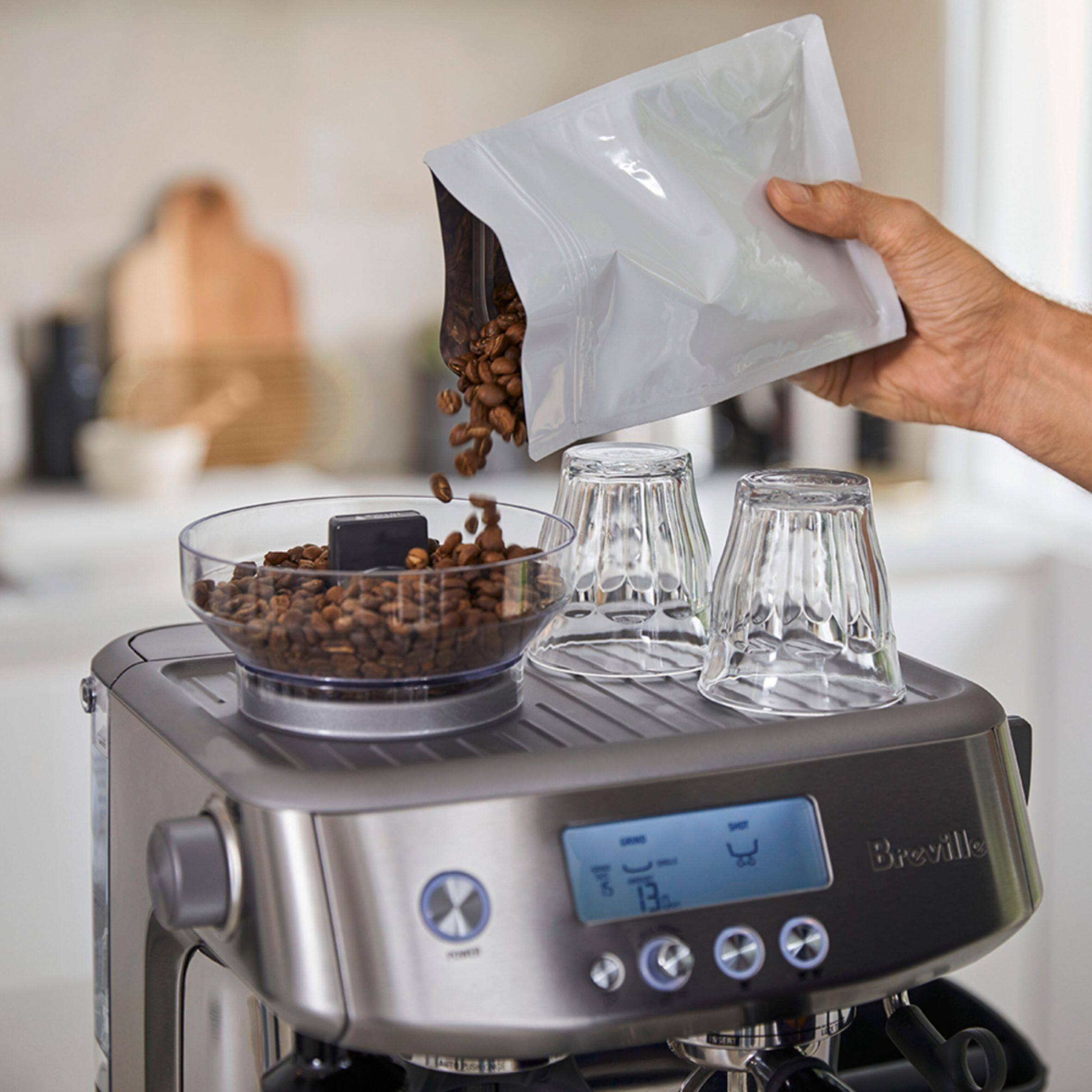 Left. Breville - the Barista Pro with a ThermoJet heating system, 3 second heat up time and precise espresso extraction - Brushed Stainless Steel.