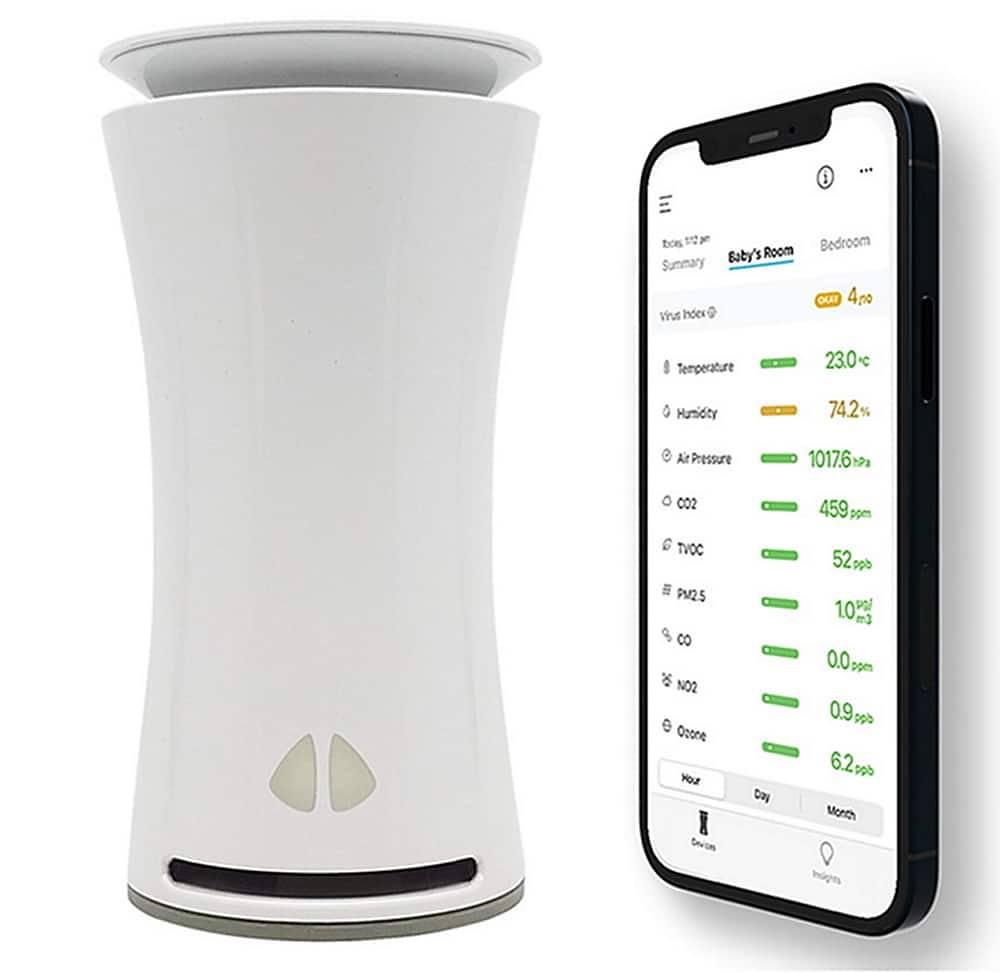 The image shows a white device, possibly an air purifier, next to a smartphone. The smartphone displays various data, such as temperature, humidity, air pressure, and TVOC levels. The data is organized in a table format, with the temperature reading at 28.9 degrees, humidity at 65.7%, air pressure at 1003.6, and TVOC levels at 90. The smartphone also displays the time as 10:02.