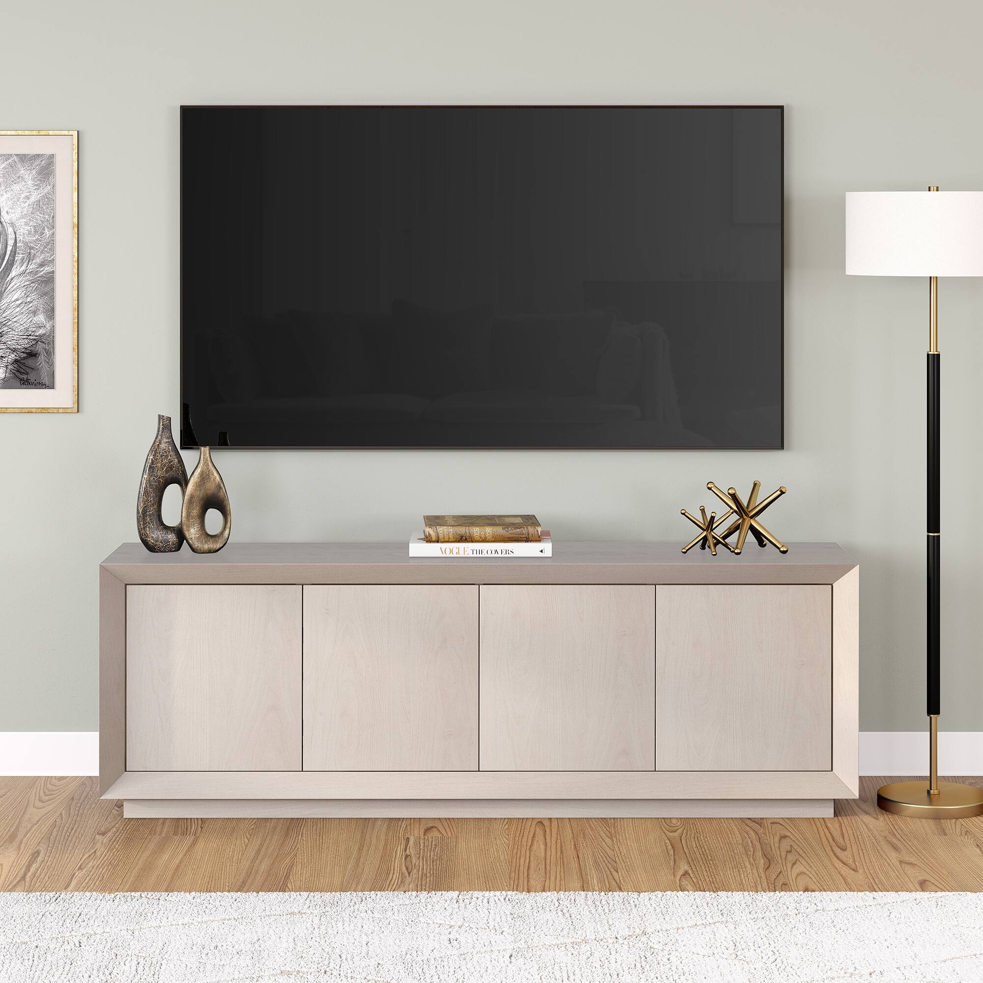 The text "MEx THOGKERS" is not present in the image. The image features a television on a stand, a lamp, and a book.