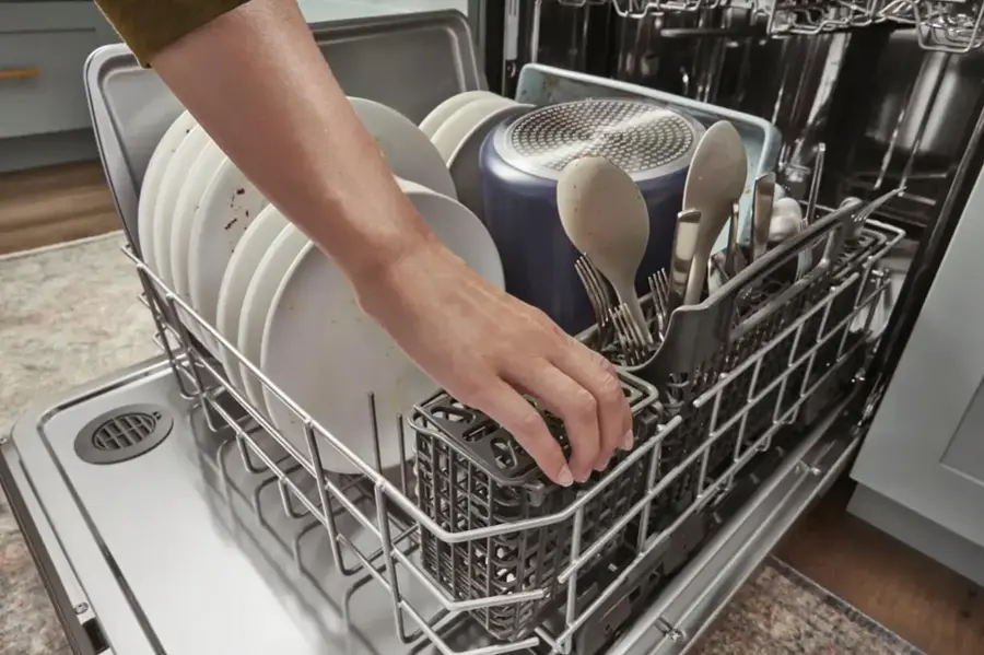 The text on the image reads: "Load hard-to-fit utensils and extra silverware in the 3rd Rack."
