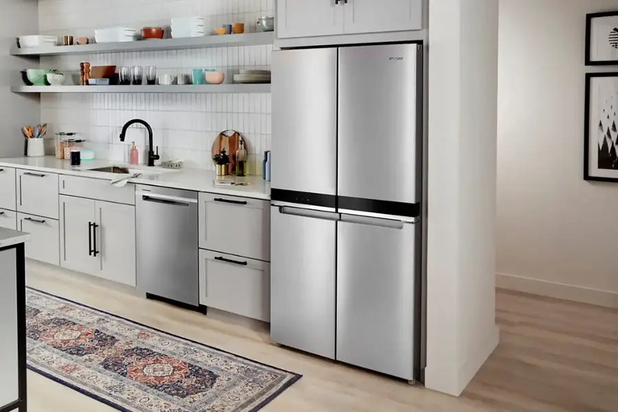 The text "Whirgeo llll" is not present in the image. The image shows a kitchen with a refrigerator, sink, and cabinets.