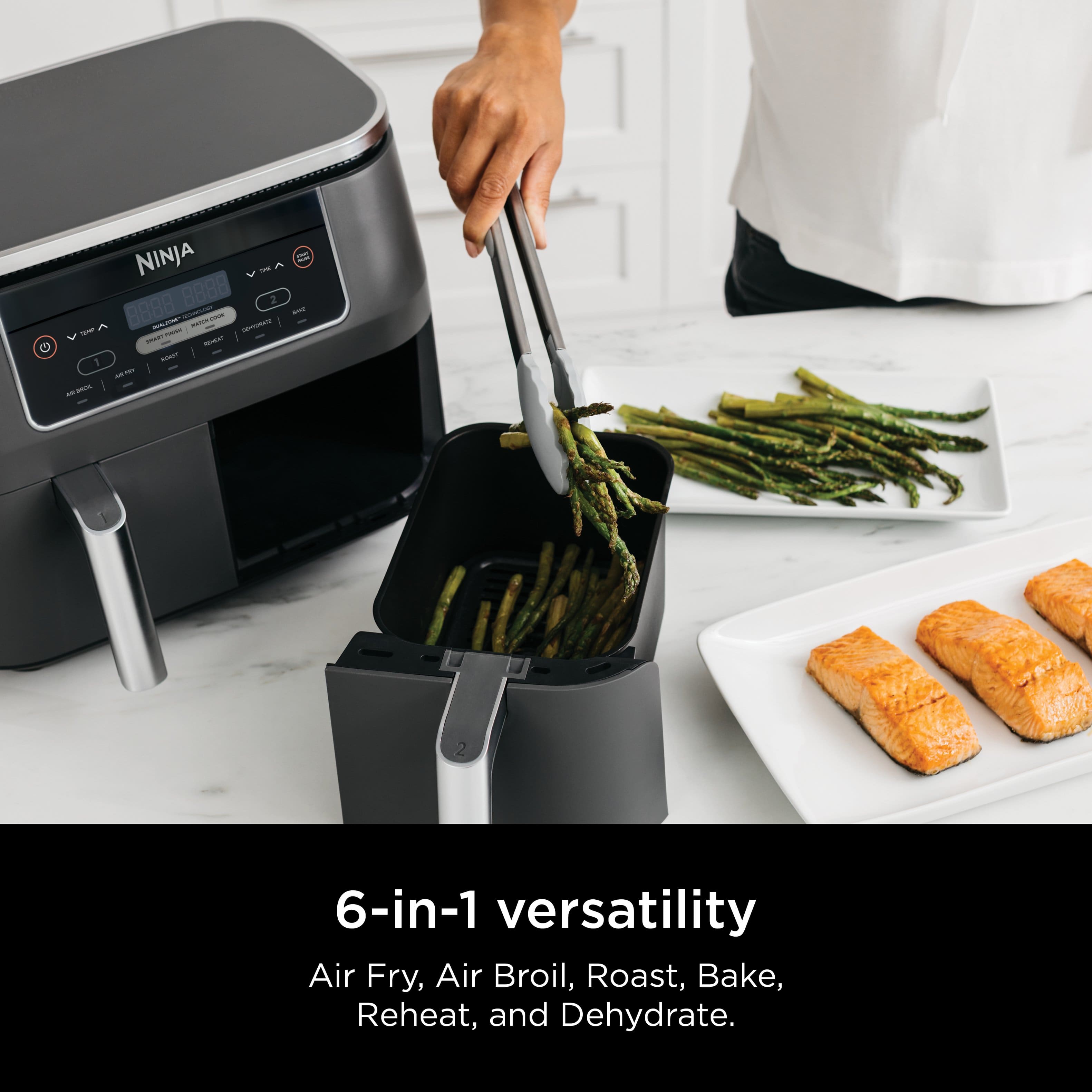 The text on the image reads: "NINJA Yl - A Y 8888 2 | - -- - - - : JTAS - - - - 1 - NveN - - 6-in-1 versatility Air Fry, Air Broil, Roast, Bake, Reheat, and Dehydrate."