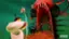 Samurai Jack, a popular animated television series, features a character who is a skilled warrior and travels through time. In the image, the main character is depicted as a cartoon figure holding a bow and arrow, ready to take on a challenge. The scene takes place in a setting with a large, menacing creature, possibly a monster or an opponent, and a doorway. The character's determination and skill in using the bow and arrow are evident in the image, showcasing the action-packed nature of the show.
