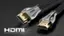 The image features two HDMI cables, one gold and one black, placed on a black background. The cables are connected to a computer, and the HDMI logo is visible on the cables. The cables are positioned in a way that they appear to be coming out of the computer, suggesting that they are used for connecting the computer to a display or other devices. The image emphasizes the importance of high-quality cables for optimal performance and compatibility with various devices.