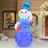 Front. Novelty Lights - 7’ Inflatable Swirling Lights Snowman with tipping Hat - White.