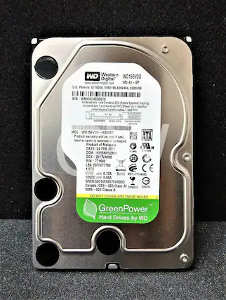 WD Western Digital
www.westerndigital.com
U.S. Patents: 6178056, 5956196, 6289484, 6263459
S/N: WMAVU4030578
Jumpered pins 1 and 2 enable SSC (Spread Spectrum Clocking)
Jumpered pins 3 and 4 enable PUIS (Power Up in Standby)
Jumpered pins 5 and 6 enable 1.5GB PHY
MDL: WD15EVDS
63V9B1
Product warranty will be void if seal, label or cover is removed or damaged.
Product of Malaysia
DATE: 24 FEB 2011
DCM: HHRNHV2MH
DCX: 3017V4690
R/N: 771640
LBA: 2930277168
1.5TB
5VDC 0.70A
12VDC 0.55A
WNN: 500
