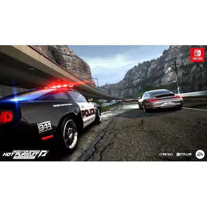 The image features a police car driving down a road, with another car following behind it. The police car is positioned on the left side of the road, while the other car is on the right side. The scene appears to be part of a video game, as the cars are moving quickly and the road is curved. The police car has its lights on, indicating that it is responding to an emergency or pursuing another vehicle. - E10+ (Everyone 10+)