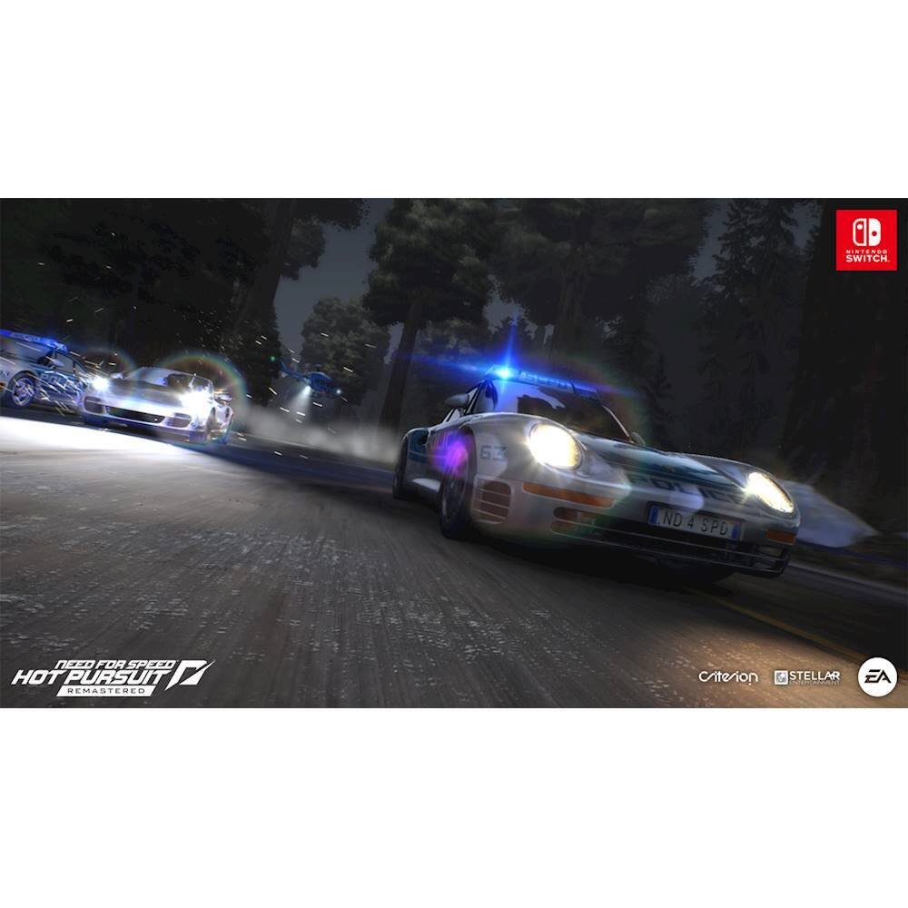 The image features a video game scene with two cars racing down a street. One car is a white sports car, while the other is a blue sports car. The white car is in the foreground, and the blue car is further back on the street. The scene is set at night, with the cars' headlights illuminating the road. The image is part of the Hot Pursuit video game series, which has been remastered for the Nintendo Switch.