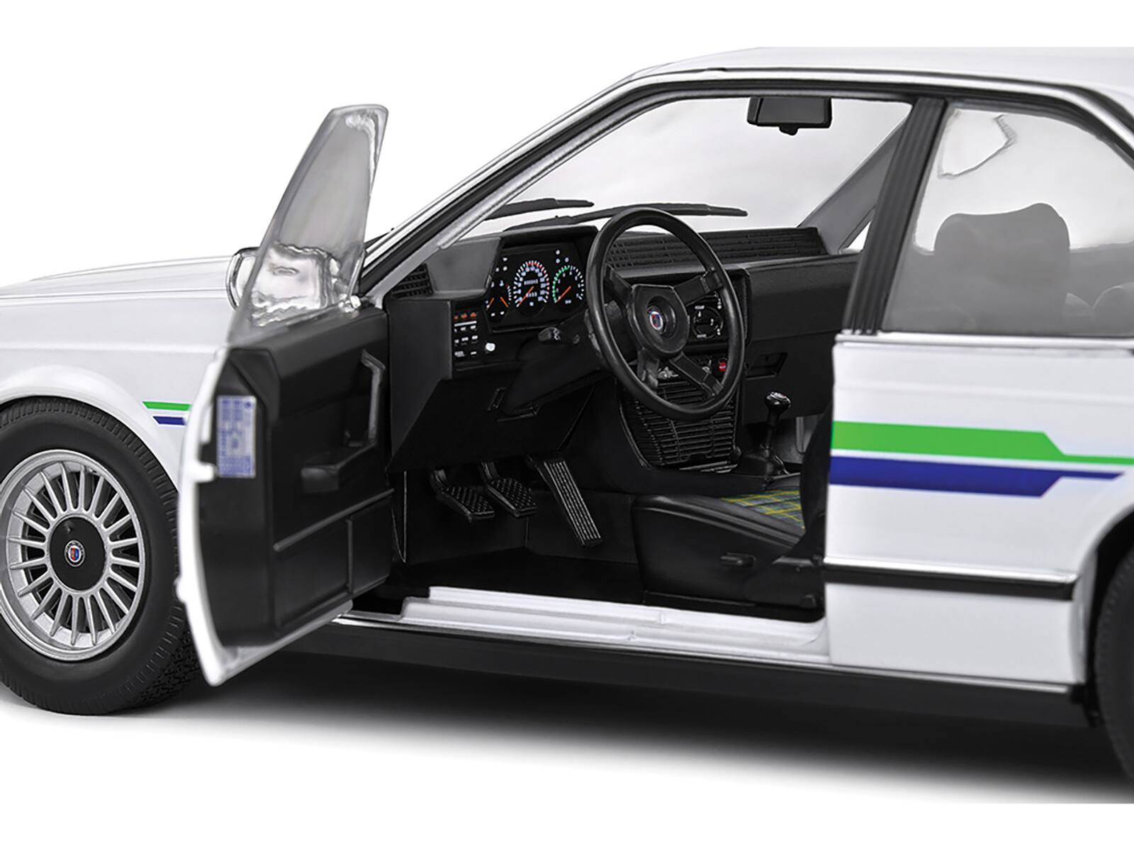 Left. Solido - 1984 BMW Alpina B7 Turbo (E24) White with Blue and Green Graphics 1/18 Diecast Model Car by Solido - White with Blue and Green.