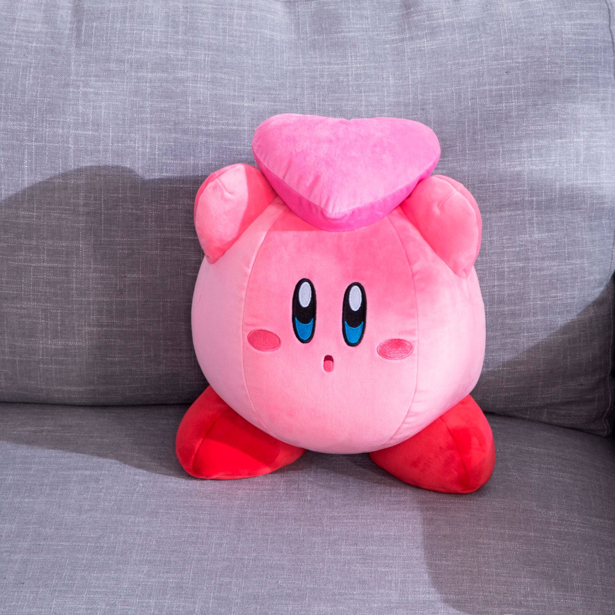 kirby holding heart plush