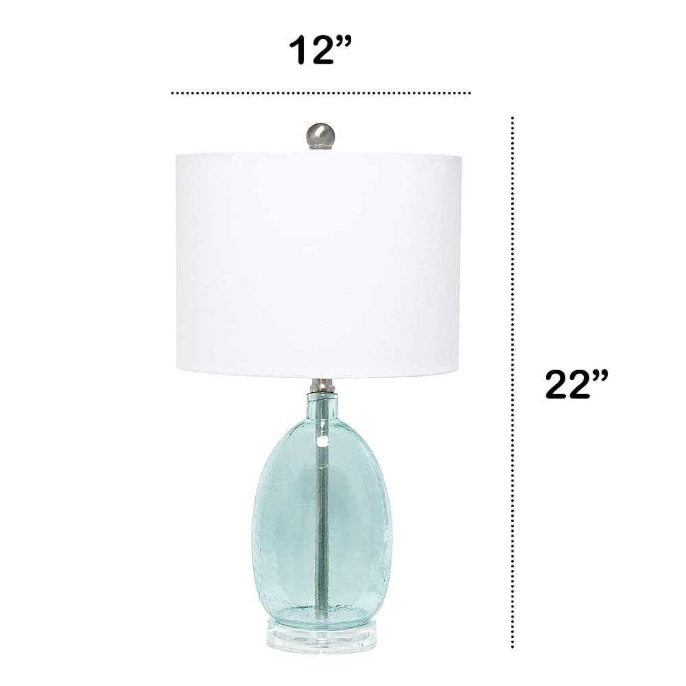 Left View: Lalia Home Oval Glass Table Lamp with White Drum Shade, Clear Blue