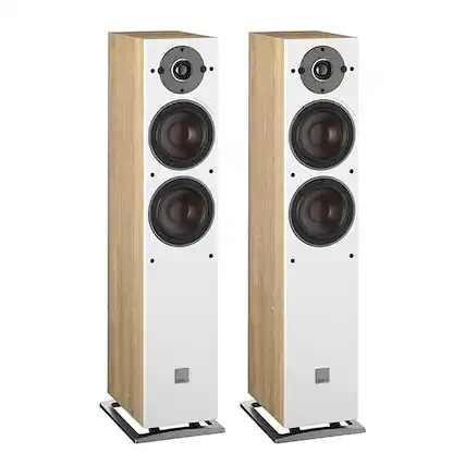 "DVE TAld" is not a valid grouping or correction. The image shows two white speakers with wooden bases, standing side by side.