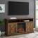 Alt View 13. Walker Edison - Farmhouse Tall Barndoor Soundbar Storage Fireplace TV Stand for Most TVs up to 65" - Rustic Oak.