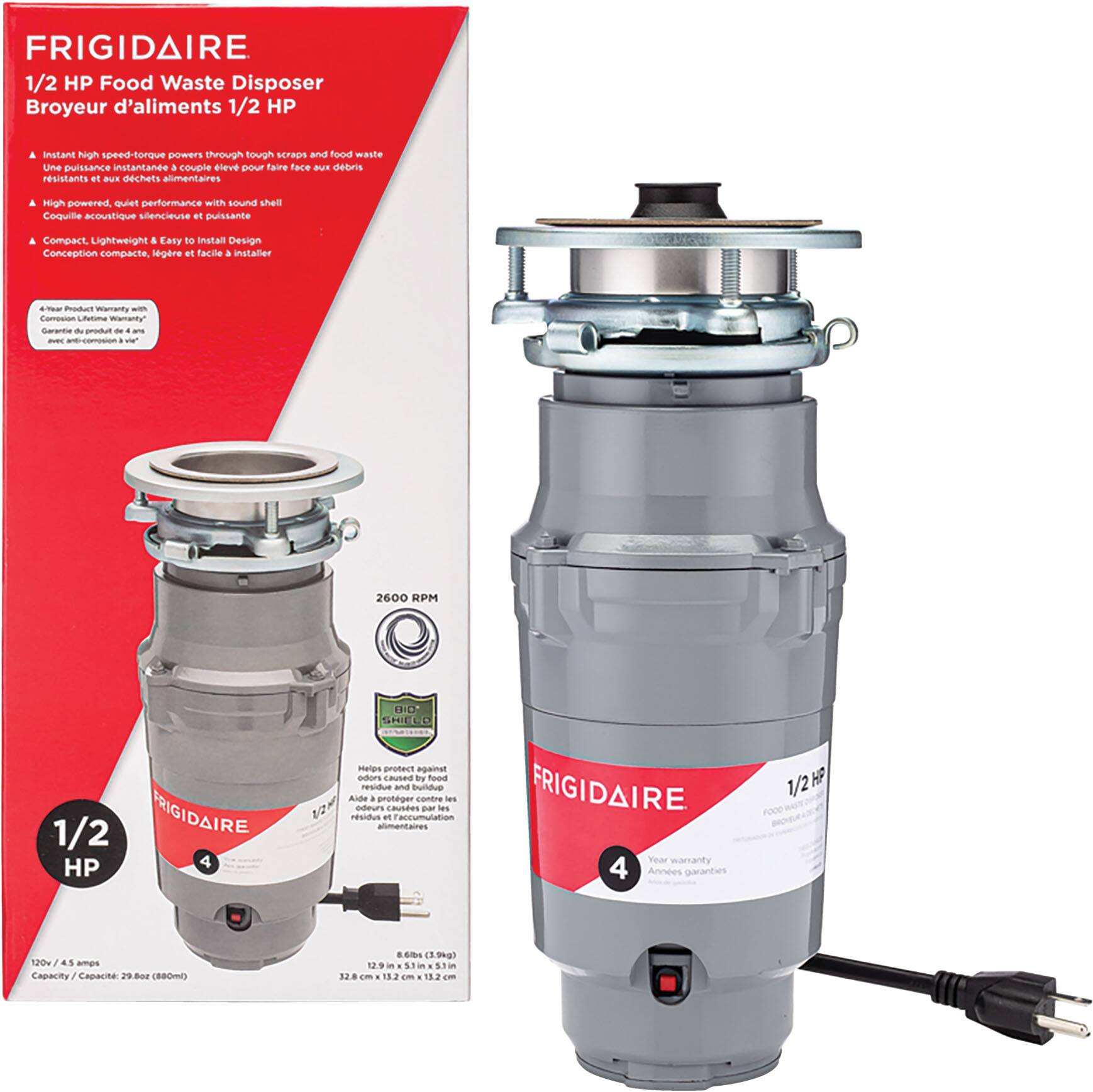 The image features a Frigidaire 1/2 HP food waste disposer, which is a compact and efficient appliance for disposing of food waste. The waste disposer is sitting next to its box, and it is ready to be installed. The box contains the necessary instructions and information for proper installation and use of the appliance. The waste disposer is designed to provide instant high-speed torque through tough SCU and food waste, ensuring optimal performance and quick processing of waste materials.