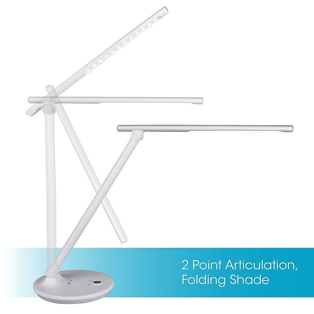 The image features a desk lamp with a unique design, offering 2 point articulation and a folding shade. The lamp is white and has a modern appearance. It is placed on a white surface, which further accentuates its sleek design. The folding shade allows for adjustable lighting options, making it a versatile and functional piece of furniture for various lighting needs.