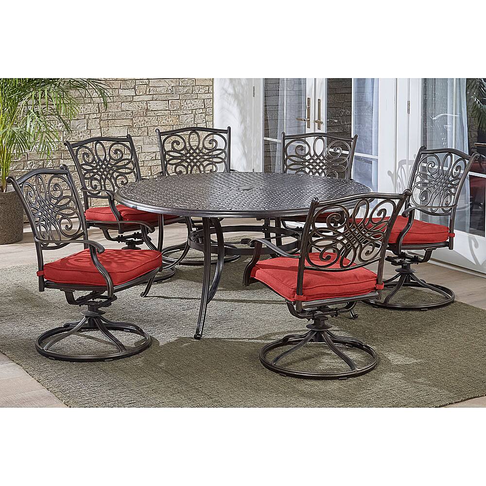 Left View: Hanover - Traditions 7-Piece Dining Set with a 60 In. Round Cast-top Table and Six Swivel Rockers - Alumicast/Red