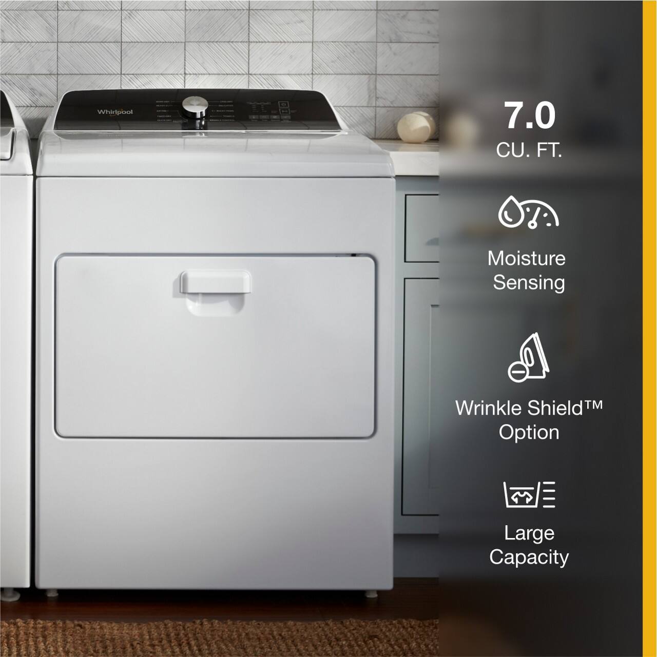The image features a large capacity Whirlpool washer and dryer set. The washer has a moisture sensing wrinkle shield option, which helps to prevent wrinkles in clothes. The dryer is also described as having a large capacity, making it suitable for drying multiple loads of laundry at once. The appliances are placed in a kitchen setting, with a sink and a bowl visible in the background.