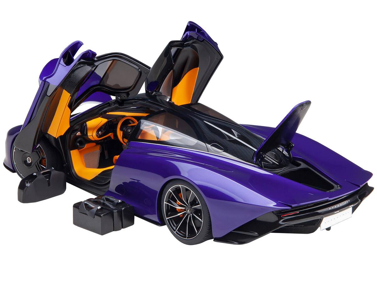 Angle. Autoart - McLaren Speedtail Lantana Purple Metallic with Black Top and Yellow Interior and Suitcase Accessories  1/18 - Purple Metallic With Black.
