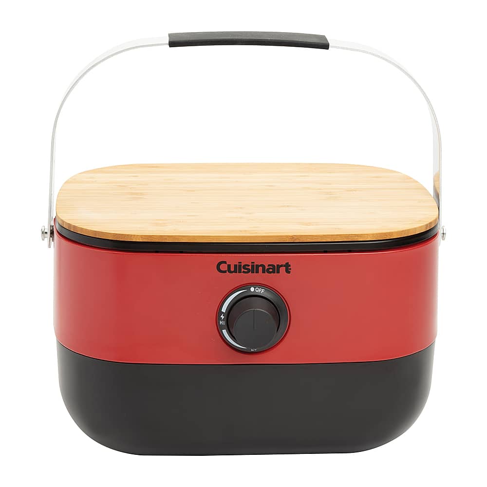 The image features a Cuisinart appliance, which appears to be a small red and black food processor or blender. It is sitting on a wooden surface, possibly a counter or table. The appliance is turned off, indicating that it is not currently in use.