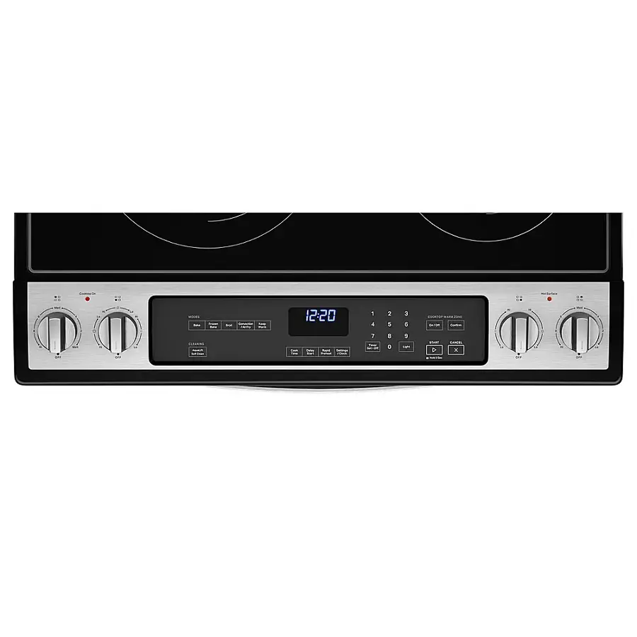 The image shows a stove with the time 12:20 displayed on the digital clock.