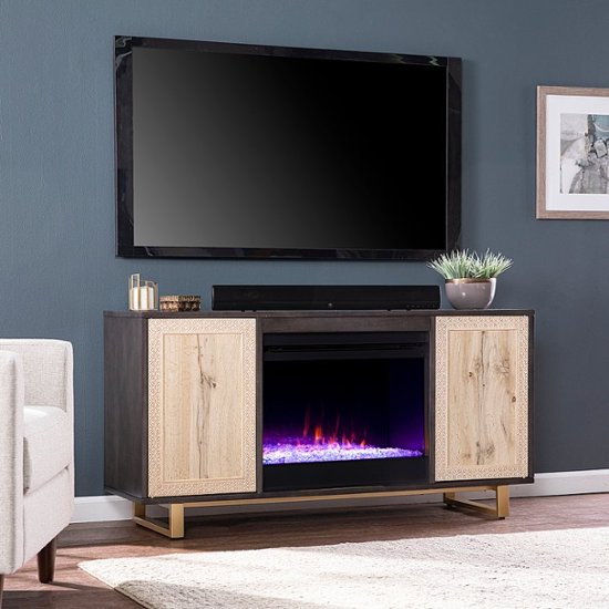 Angle Zoom. SEI - Wilconia Color Changing Fireplace w/ Media Storage and Carved Details - Dark brown, natural, and gold finish.