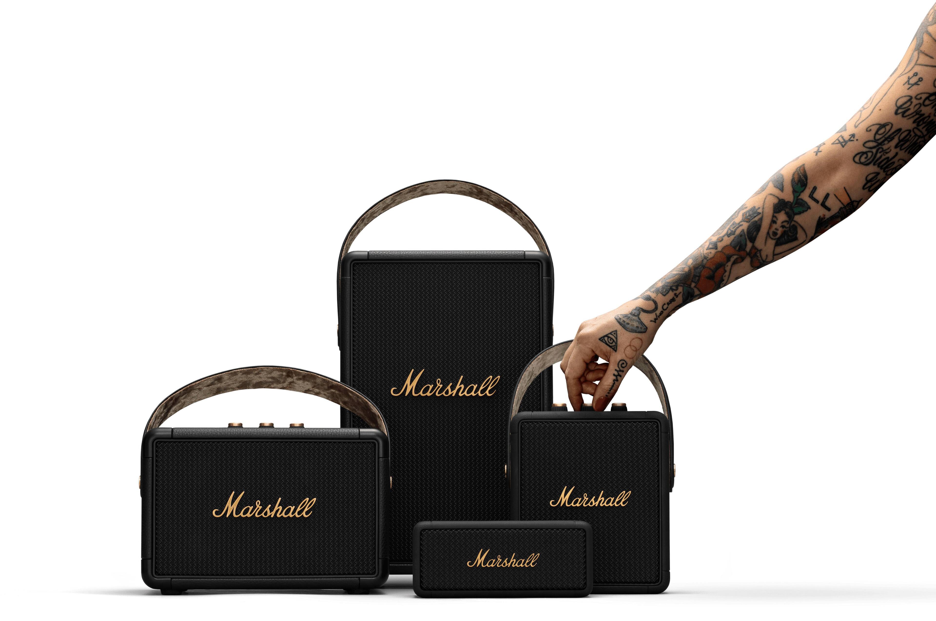 Marshall is the brand of the guitar amplifier in the image.