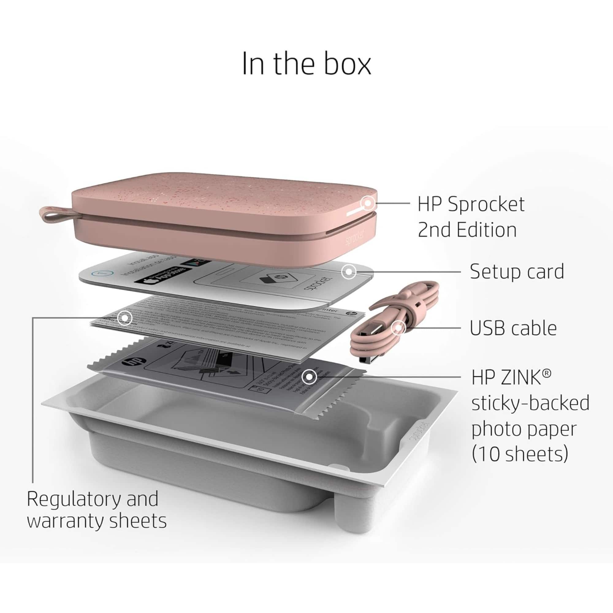 In the box, there is an HP Sprocket 2nd Edition, a setup card, a USB cable, and a 10-sheet pack of HP ZINK sticky-backed photo paper. Additionally, there are regulatory and warranty sheets included.