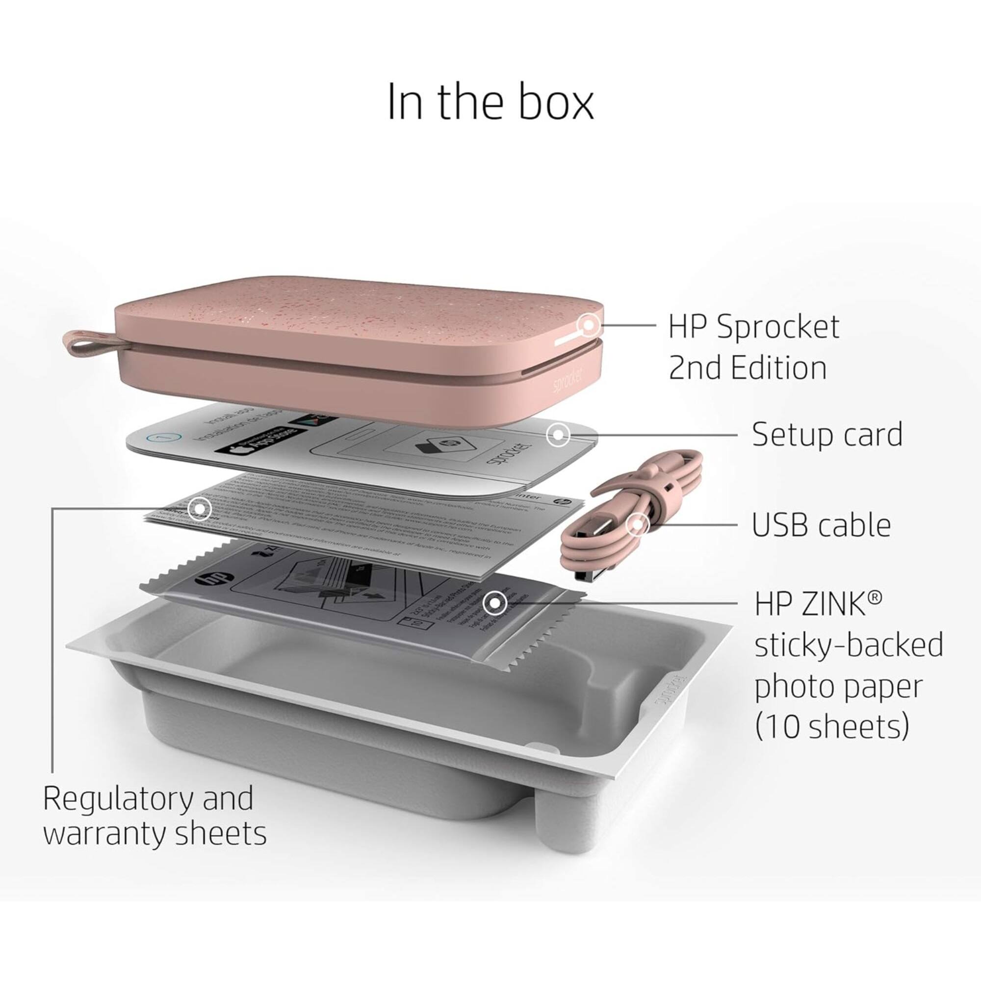 In the box, there is an HP Sprocket 2nd Edition, a setup card, a USB cable, and a 10-sheet pack of HP ZINK sticky-backed photo paper. Additionally, there are regulatory and warranty sheets included.