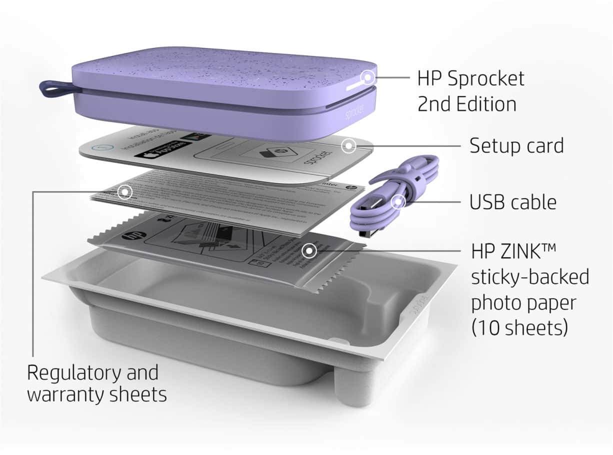 The image features a person holding a HP ZINK sticky-backed photo paper, which is a type of photo paper that can be easily attached to various surfaces. The paper is being used to print a photo, and the person is holding it in their hand. The image also shows a USB charging port and a power button, which are likely part of a device that is being used to print the photo. Additionally, the photo paper is described as personalized LED lights, which suggests that the photo paper may have a unique design or pattern that can be illuminated by LED lights.