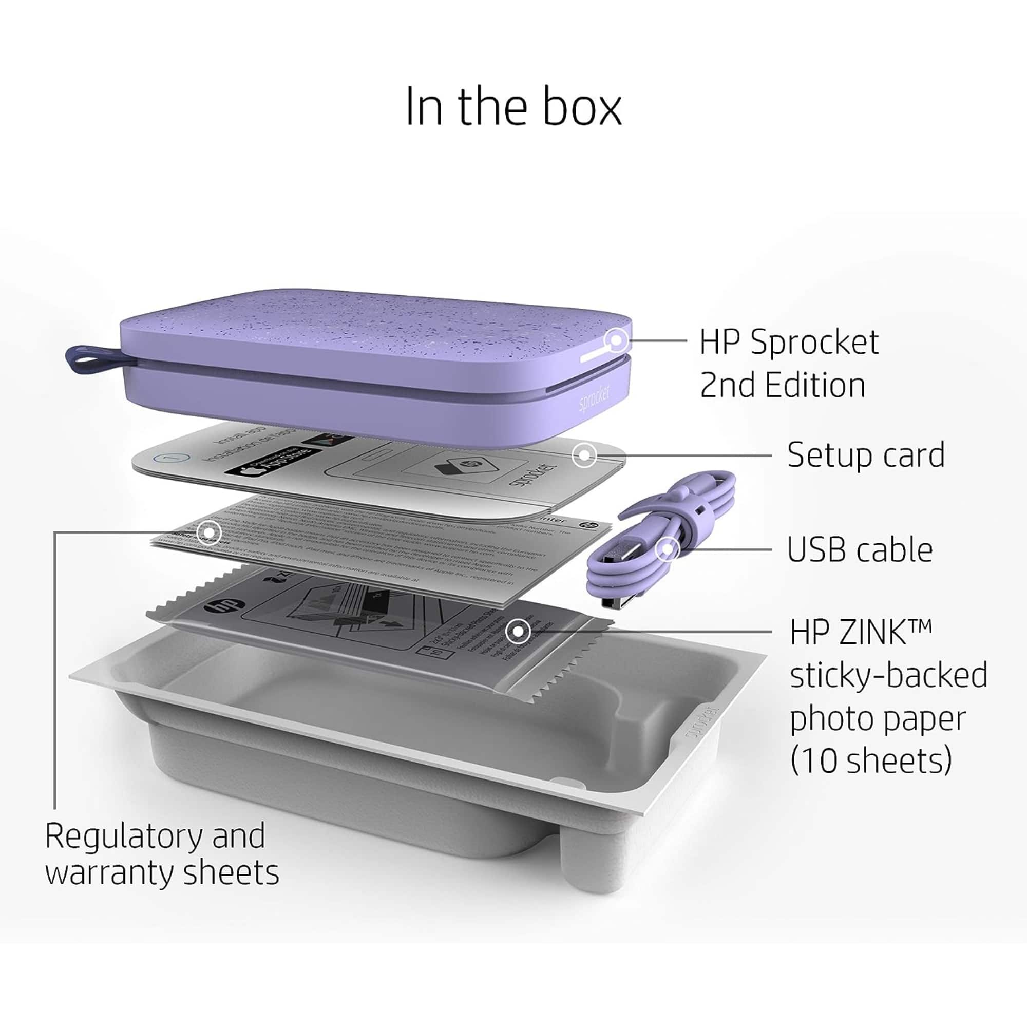 In the box, there is a HP Sprocket 2nd Edition, a setup card, a USB cable, and HP ZINKTM sticky-backed photo paper (10 sheets). Additionally, there are regulatory and warranty sheets included.