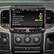 The image shows a car's dashboard with a screen displaying various audio settings. The largest text reads "Audio Settings," and the screen is divided into different sections, such as "Defeat ttft Equalizer Crossover Tame Comection Factory EQ X OFF." The screen also features a volume control with "Source Gain Volume Settings" and "Reset" options. The car's dashboard also includes a "PRND" button for gear selection.