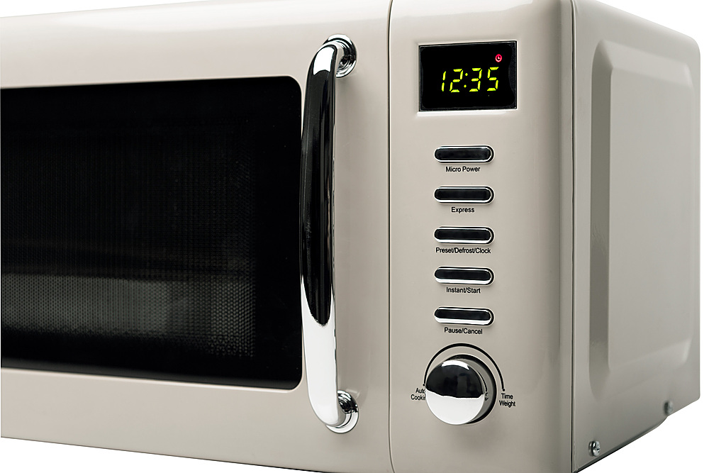 Left View: Haden Dorset 700-Watt .7 cubic. foot Microwave with Settings and Timer - Putty