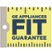 The image features a yellow and blue sign that reads "GE Appliances Fit Guarantee." The sign is placed on top of a ruler, which is used to measure the dimensions of the appliances. The ruler is positioned horizontally across the image, with the sign placed above it. The combination of the ruler and the sign suggests that the appliances are designed to fit perfectly in their designated spaces.