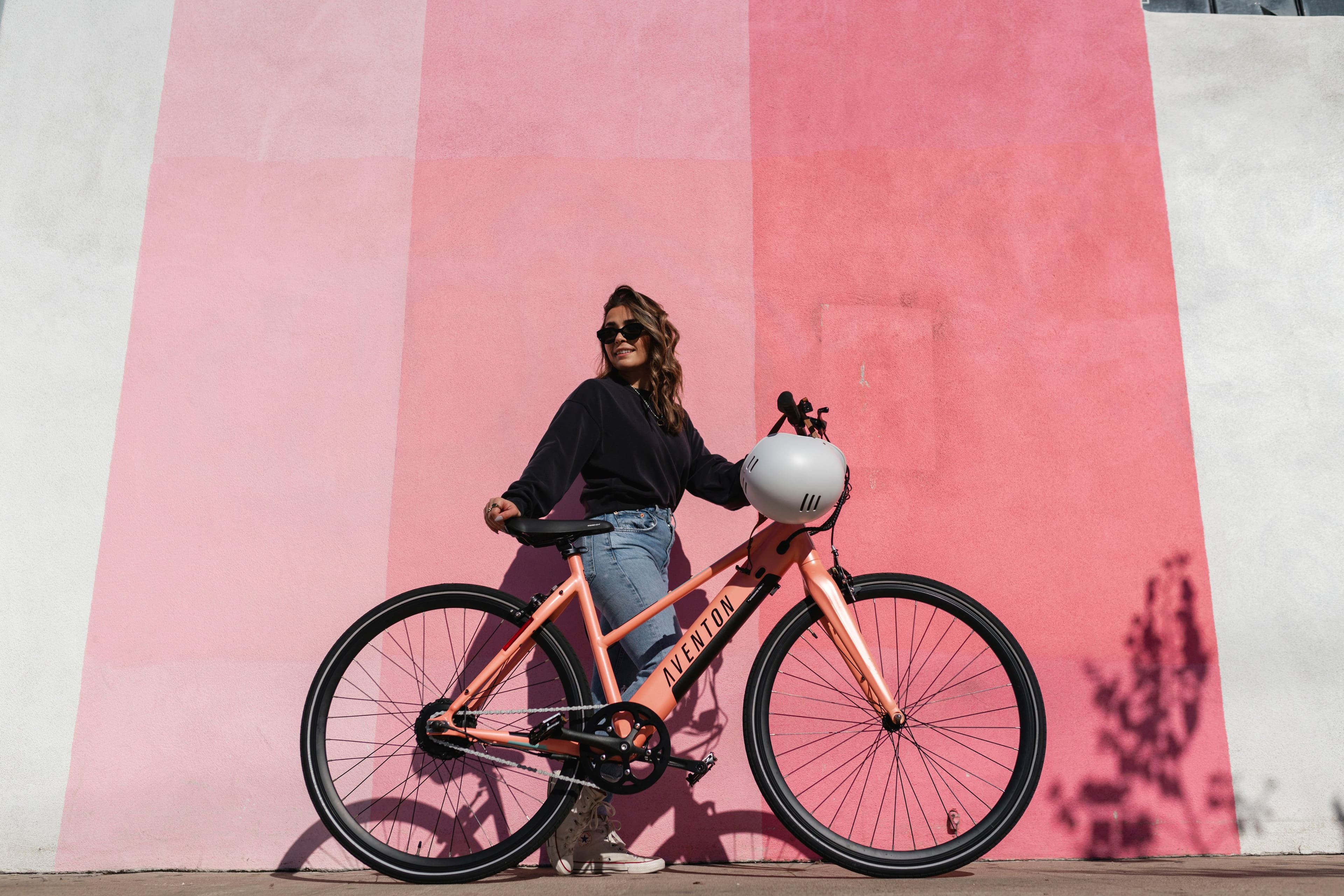 Left View: Aventon - Soltera Step-Through Ebike w/ 40 mile Max Operating Range and 20 MPH Max Speed - Medium/Large - Salmon Pink