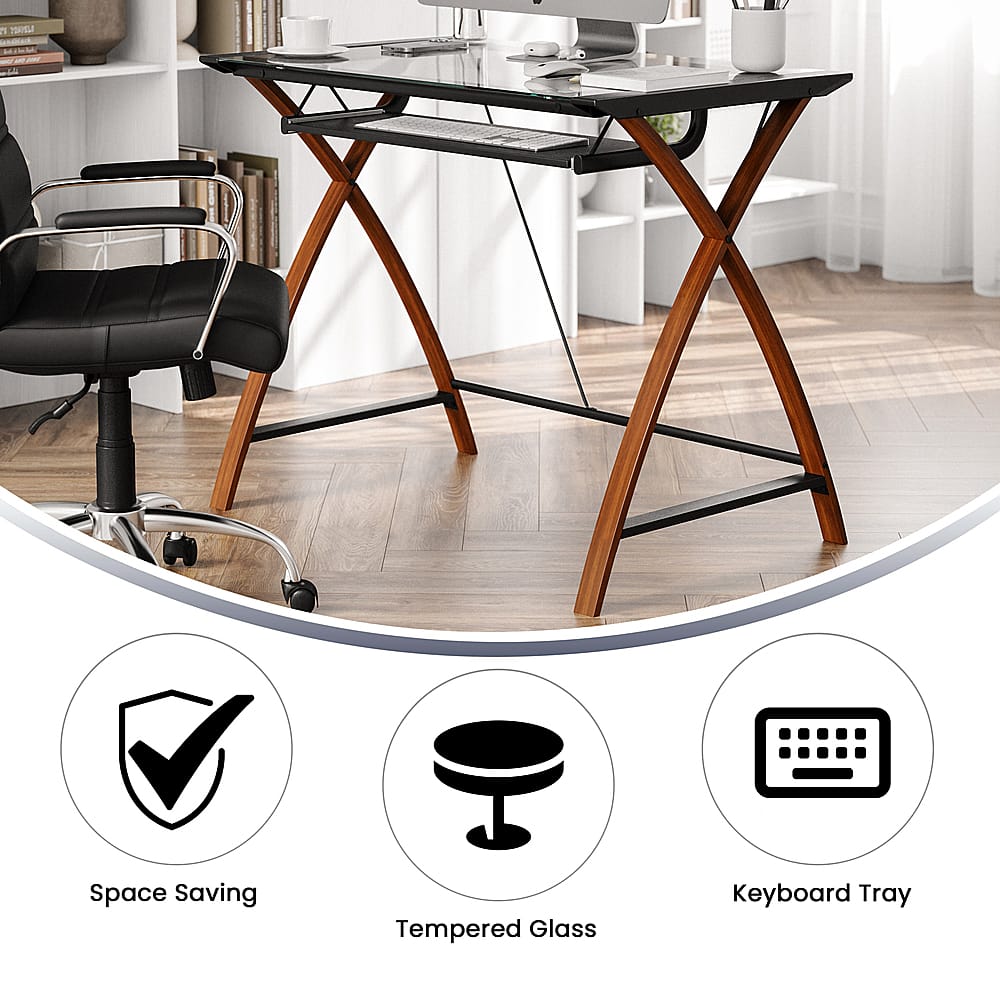 The image features a wooden desk with a laptop, keyboard, and mouse on it. There is a chair positioned in front of the desk. The desk is accompanied by a keyboard tray, which is designed to save space and provide a convenient workspace. The desk also has a monitor, which is likely connected to the laptop. The overall scene suggests a well-organized and functional workspace.