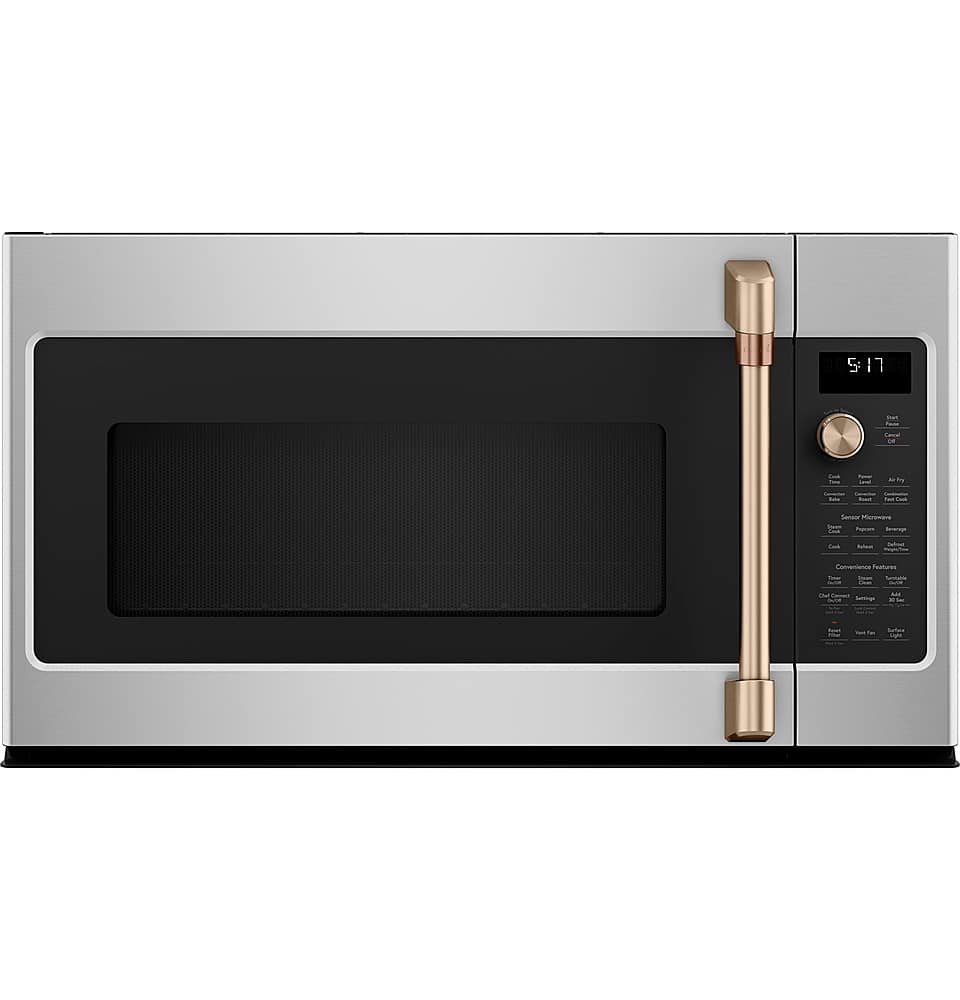 The image features a stainless steel microwave oven with a black door. The oven has a digital display on the front, which shows the time and possibly other settings. The microwave is currently set to 9:13.
