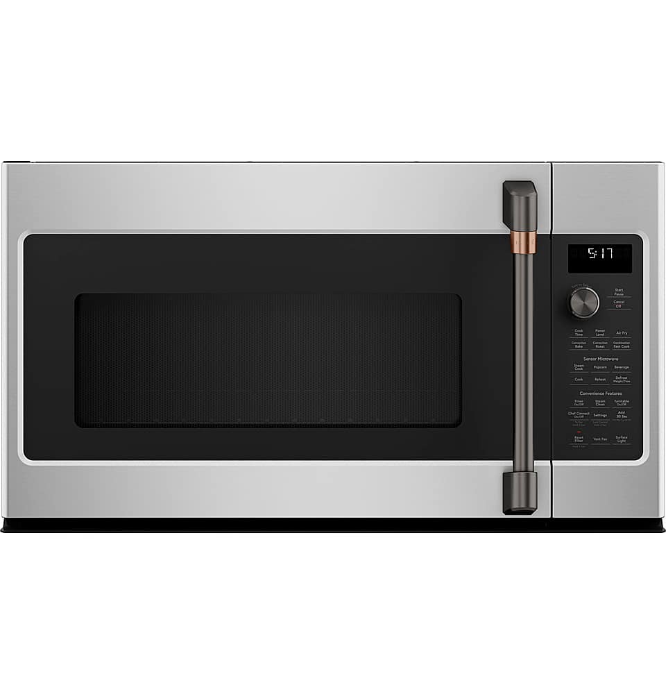The image features a stainless steel oven with a black door. The oven has a digital display on the front, which shows the time and temperature. The time on the display is 9:13. The oven is closed, and the door is open, revealing the interior. The oven is a modern appliance, likely designed for convenience and efficiency.
