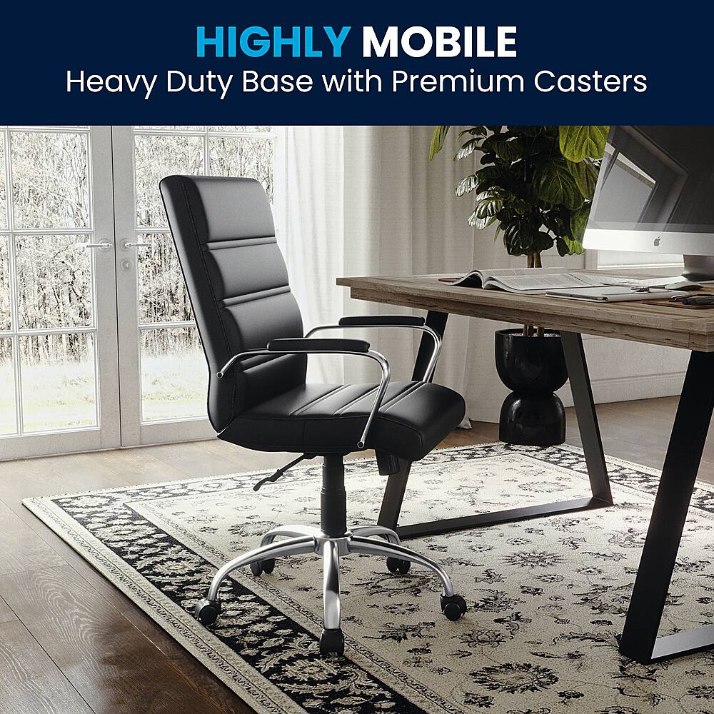 The image features a black office chair with a heavy-duty base and premium casters, which allows for easy movement and stability. The chair is placed on a rug, and there is a desk with a laptop and keyboard nearby. Additionally, there is a potted plant in the scene, adding a touch of greenery to the office space.