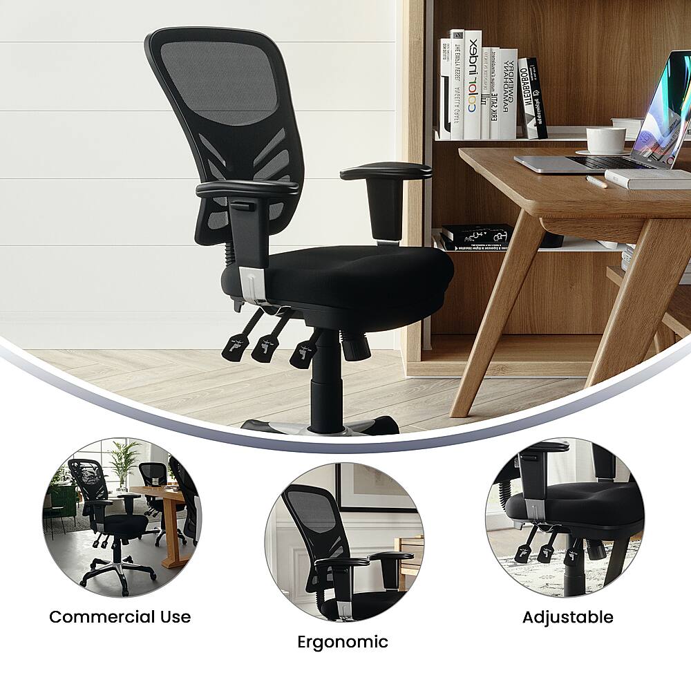The image features a black office chair with a black armrest, placed in front of a wooden desk. The chair is designed for commercial use and is ergonomic, allowing for adjustments to ensure comfort and proper posture. The desk is equipped with a laptop and several books, indicating a workspace setup. The chair is also adjustable, providing flexibility for the user's needs.