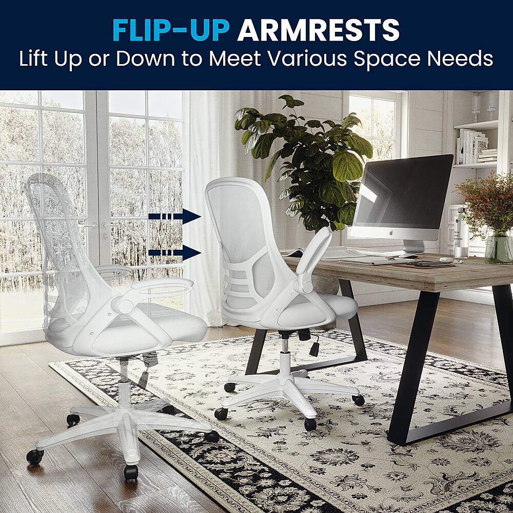 The image showcases a white office chair with a flip-up armrest, which allows the user to adjust the armrest according to their needs. The chair is placed on a rug, and there is a potted plant nearby. The room also contains a TV and a laptop on a desk, indicating a workspace setup. The flip-up armrest feature is particularly useful in small spaces or when the user needs to free up space for other activities.