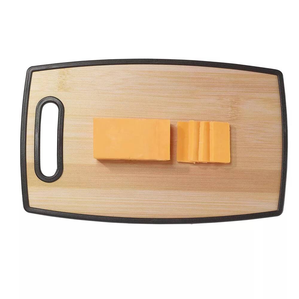 Angle. Elle Decor - 9" × 14.5" Kitchen Cutting Board with Handle, Durable Bamboo‑Designed Plastic, Dishwasher Safe - Brown.
