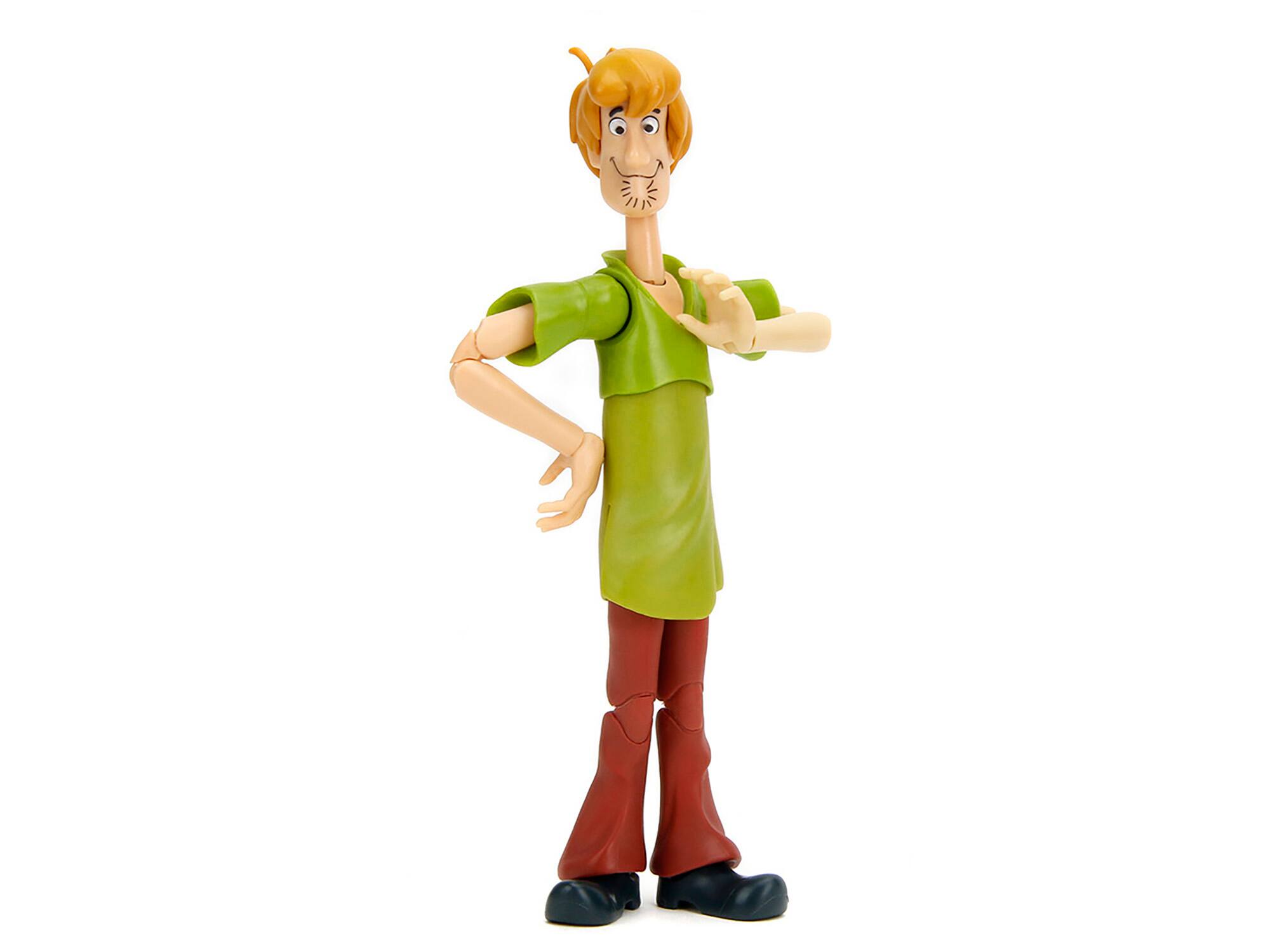Angle. Jada - Shaggy Rogers 6.5" Moveable Figure with Accessories and Alternate Head and Hands "Scooby-Doo!" Franchise Model by Jada - Multicolor.
