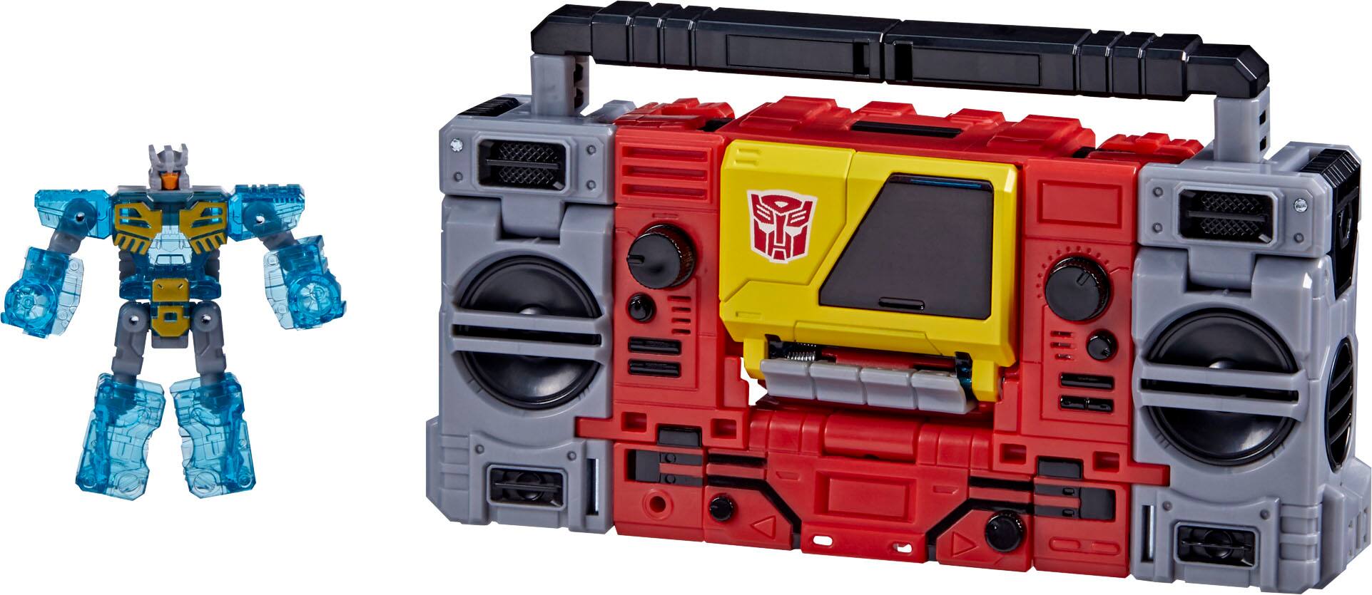 Left. Transformers - Generations Legacy Voyager Autobot Blaster & Eject.