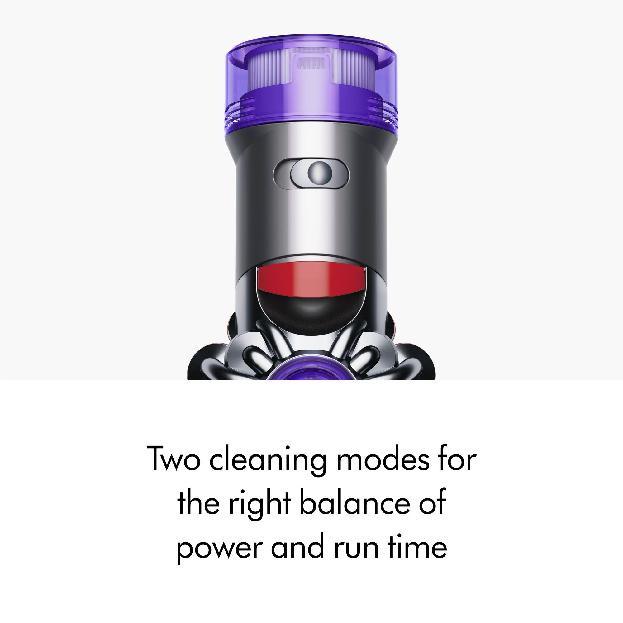The image features a large, purple-colored appliance with a silver body, which appears to be a vacuum cleaner. The appliance has a large, round container on top of it, and it is described as having two cleaning modes for the right balance of power and run time. The image is a close-up of the appliance, showcasing its design and features.