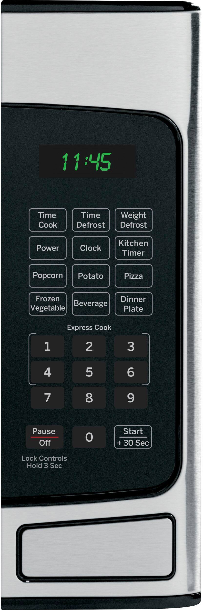 Angle. GE - 1.1 Cu. Ft. Mid-Size Microwave with Included Pasta/Veggie Cooker - Stainless Steel.