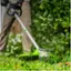 Left. Greenworks - 80V 16" Cutting Diameter  Brushless Straight Shaft Grass Trimmer 2.0 Ah Battery and Rapid Charger - Black/Green.