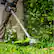 Left. Greenworks - 80V 16" Cutting Diameter Brushless Straight Shaft Grass Trimmer 2.0 Ah Battery and Rapid Charger - Black/Green.
