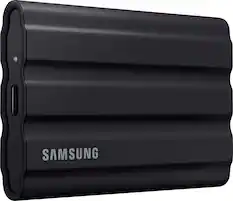 Front. Samsung - T7 Shield 1TB, External USB 3.2 Gen 2 Rugged SSD IP65 Water Resistant - Black.